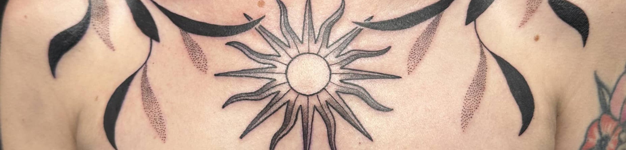 Geometric chest piece tattoo by Saul
