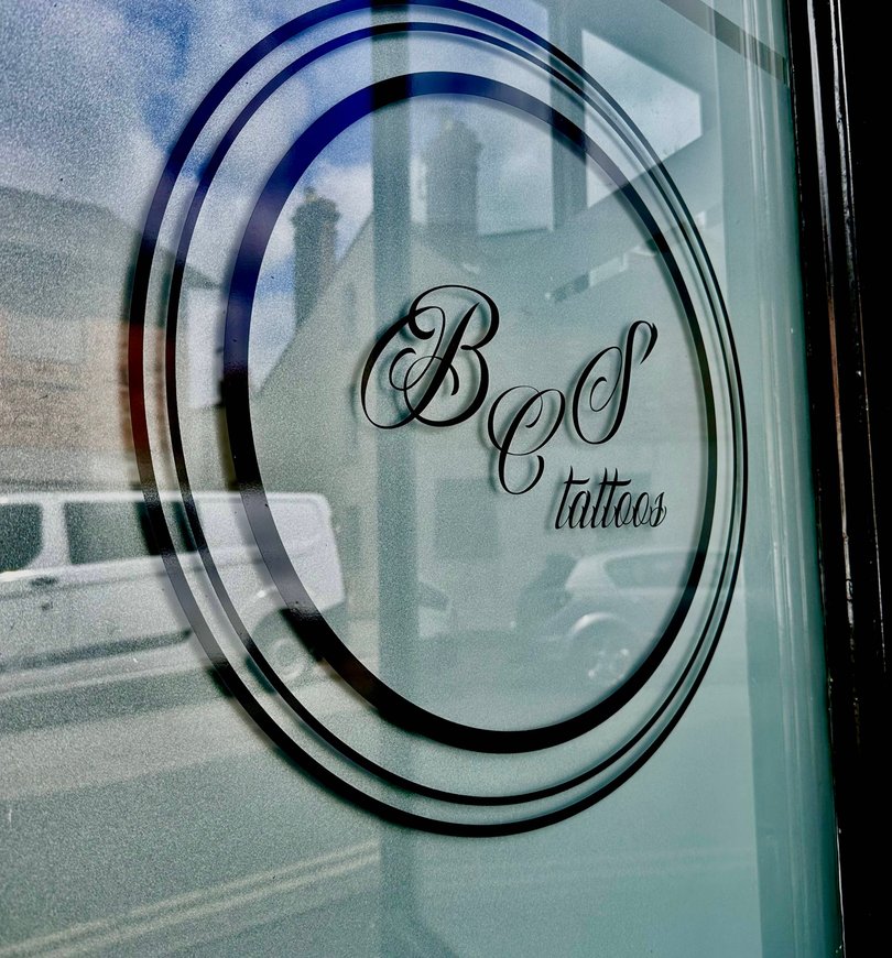 BcS Tattoos logo on the studio window